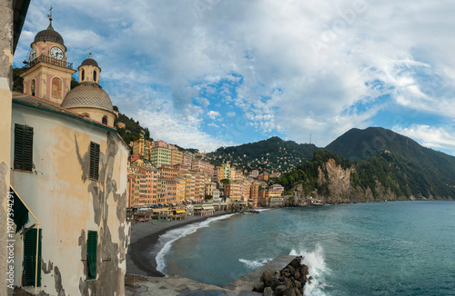 colorful houses and church domes, famous resort fishing town of Camogli on th...
