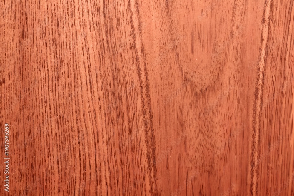 Naklejka premium Natural rich reddish mahogany wood grain texture seamless background with elegant straight lines and warm deep red brown veneer patterns