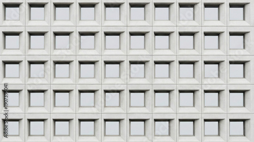 Geometric facade : A meticulously crafted architectural facade composed of repeating square windows, creating a pattern of visual rhythm and modern aesthetic appeal.