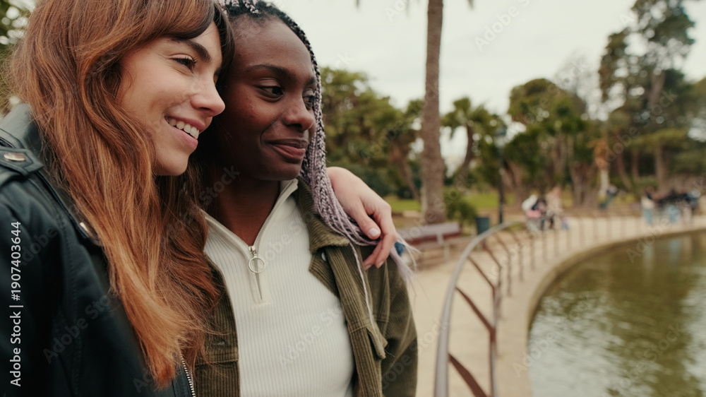 Naklejka premium Happy Lesbian Couple Smiling Together In Park