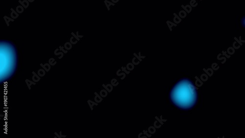 Soft blue light leak particles drifting across dark background, 4K video