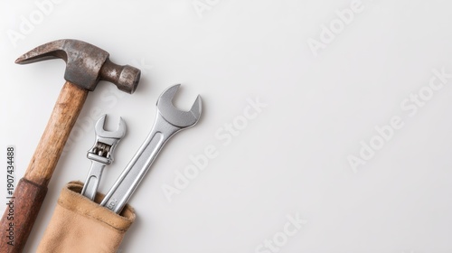 Hammer and a wrench are on a white background
