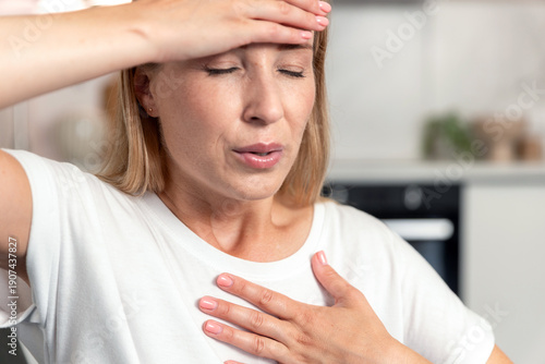 Photography Woman experiences chest pain and difficulty breathing at home during stress
