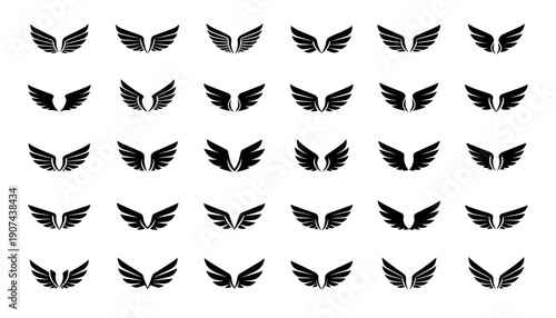 Collection of twenty five black wing emblems on white background.