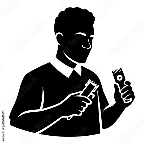 Silhouette of barber holding electric hair clippers ready for a fresh cut