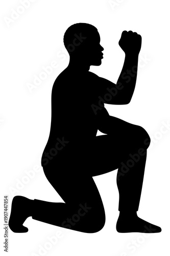 Silhouette of person kneeling with raised fist demonstrating triumph or prayer