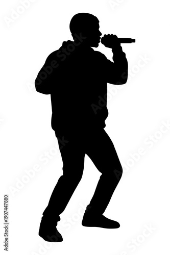 Silhouette of male performer singing passionately into a microphone on stage