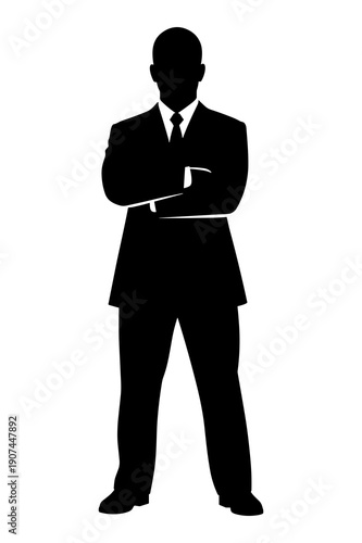 Silhouette of a confident businessman standing firm with arms crossed