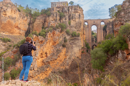 Tablou pe pânză Tourist Photographing Puente Nuevo in Ronda, Spain