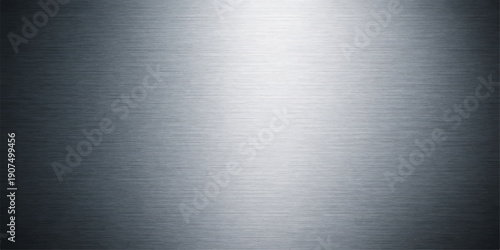 Polished silver stainless steel plate with a brushed metal texture and a shiny gray aluminum surface creates a sleek industrial metallic pattern backdrop
