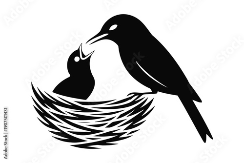 Black and white silhouette of a parent bird feeding a chick in a nest