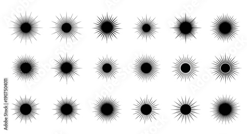 A collection of abstract starburst or sunburst graphic elements with sharp, radiating lines emanating from a central black circle.