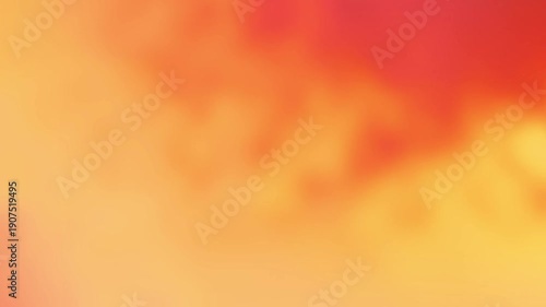 Abstract warm orange and red painting brush strokes with a soft bokeh effect, creative art background
