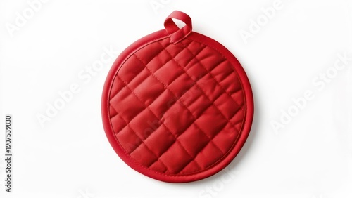 Red round quilted pot holder with hanging loop on white background.