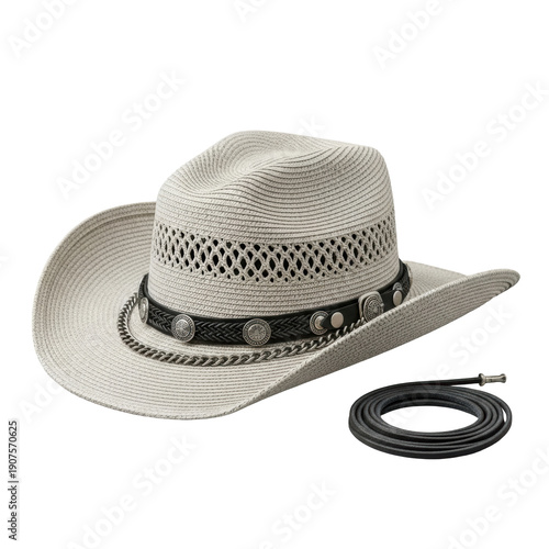 a light beige straw cowboy hat featuring a wide upturned brim and a black band with silver chain and buckles, alongside a coiled leather cord on a solid gray studio background. Concept of premium