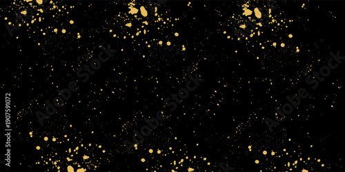 Gold glitter texture on a black background. Holiday background. Golden explosion of confetti. Golden grainy abstract  texture on a black  background.