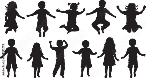 Silhouettes of happy children jumping and playing together outside