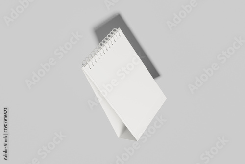 Angled Desk Calendar Mockup with Blue Spiral Binding