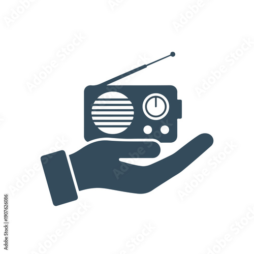 A dark blue hand holding a radio with a long antenna on a white background. Perfect for world radio day, broadcasting, and communication materials.