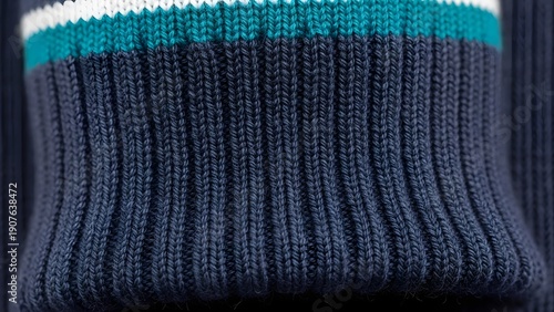 Detailed Macro View of Navy Blue Ribbed Knit Fabric Texture with Teal and White Stripes