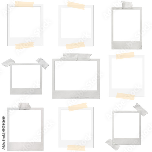 a charming collection of blank vintage polaroid instant photo frames, many secured with classic tape, isolated on black.