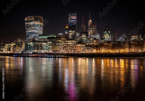London City Skyline At Night With River Thames Reflections And Illuminated Buildings