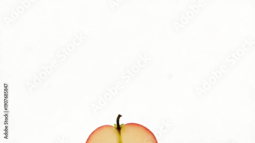 Sliced Apples Falling in Air.