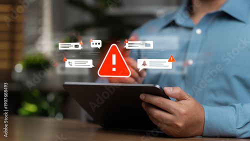 Photos Business professionals use tablets to check for anomalies, reflecting a sense of caution and effective workplace security management