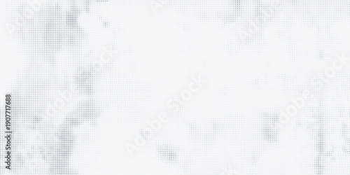 Soft abstract halftone background featuring small blue-gray dots on a light surface.