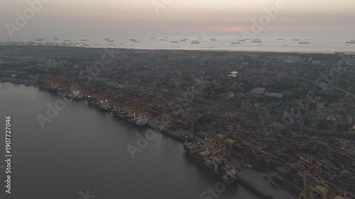 Wallpaper Mural Aerial View of Chittagong Port and Karnaphuli River at Twilight. Busy Container Terminal and Cargo Ships at Chattogram Sea Port. Global Logistics and Maritime Trade Hub at the Bay of Bengal.  Torontodigital.ca