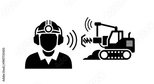 Construction worker operating heavy machinery with remote control technology.