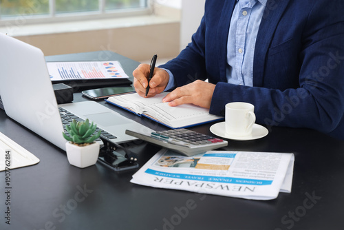 Young businessman with lapt...