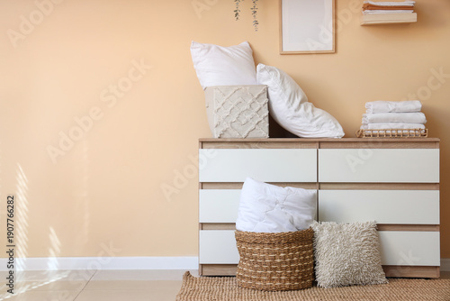 Commode with stack of clean...