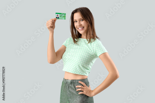 Happy young woman with driv...