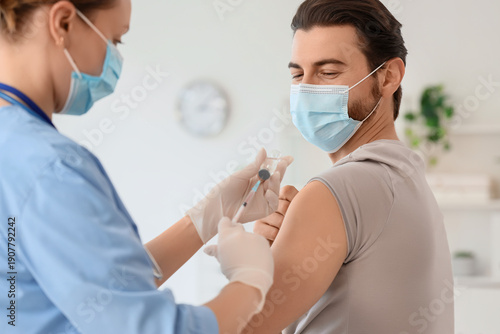 Young man with medical mask...