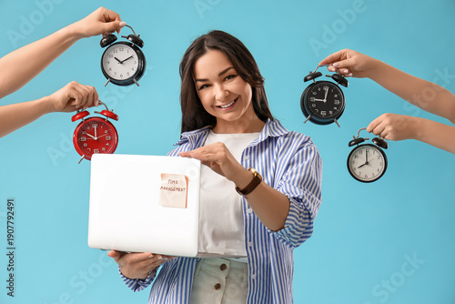 Businesswoman holding lapto...