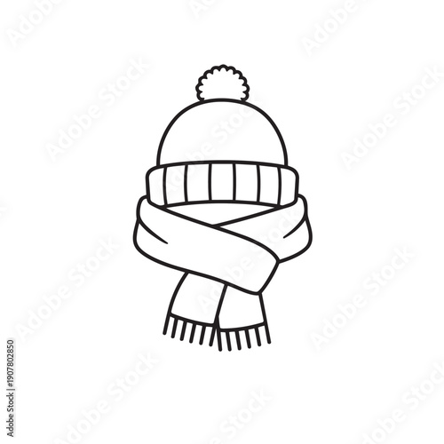 Winter accessories featuring knitted beanie hat with pom pom and long scarf wrapped around neck