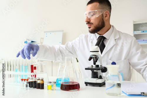 Male scientist with test tu...