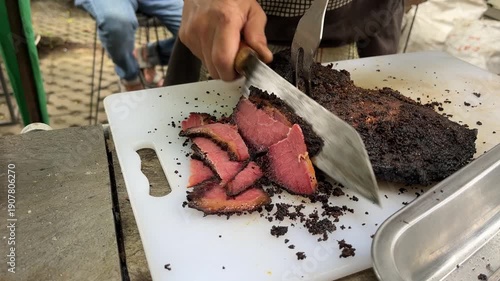 Wallpaper Mural Man slicing a loaf of smoked brisket pastrami on a cutting board, with fun vibes Torontodigital.ca