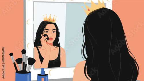 Young confident woman wearing a golden crown applies makeup while looking at her reflection in a vanity mirror with light bulbs.