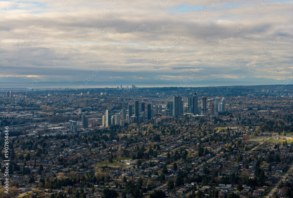Obraz premium City Skyline Over Suburban Burnaby: Modern High-Rises Amid Residential Neighborhoods at Dusk