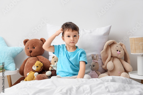 Cute little boy with toys s...
