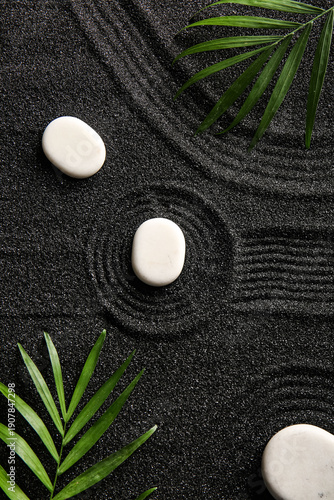 White stones and palm leave...