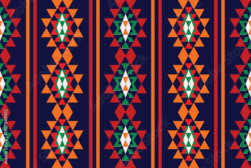 Colorful tribal geometric pattern with vibrant red, orange, green and navy tones. Repeating triangle and diamond shapes form a lively ethnic textile style, ideal for prints, crafts, fashion and decor 