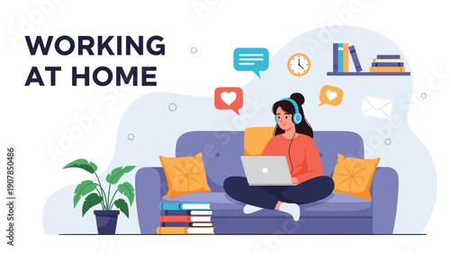 Productive woman working at home on her laptop while relaxing on a sofa with digital communications and a comfortable environment.