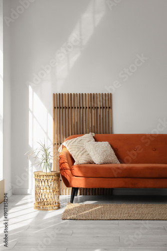 Brown sofa, houseplant and ...