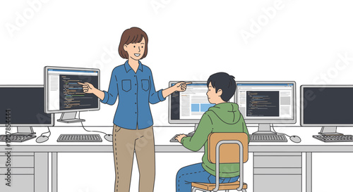 Female teacher mentoring a young student in a computer programming class, pointing at code on a screen.