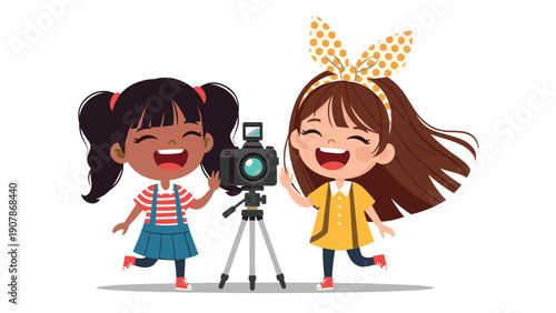Two happy young girls laughing and posing for a photo behind a professional camera mounted on a sturdy tripod.