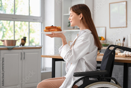 Young woman in wheelchair w...