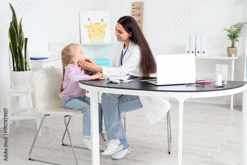 Female pediatrician examini...